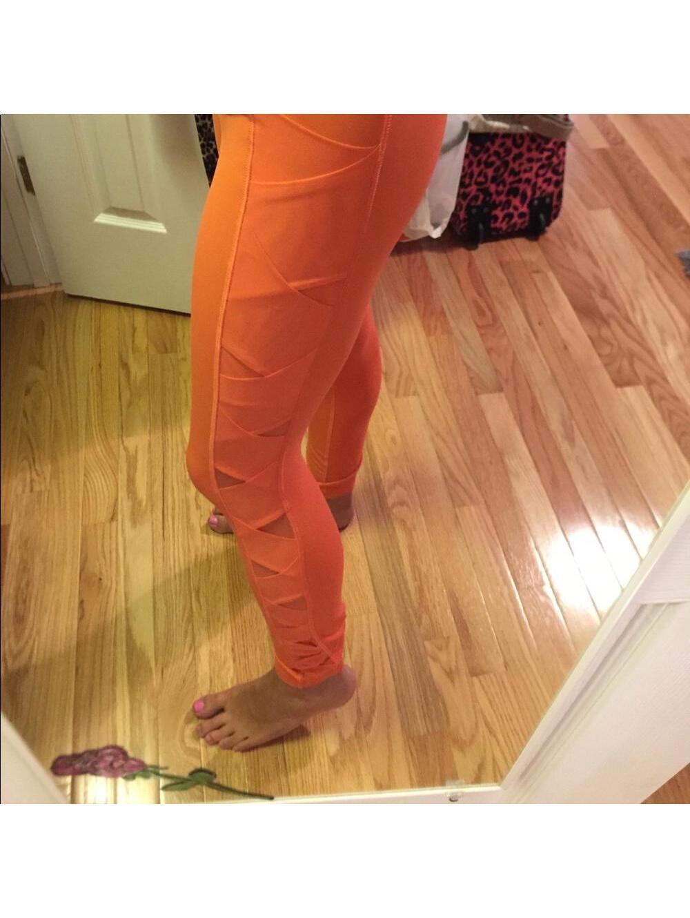 Rare lulu lemon leggings orange size 4 mesh accents